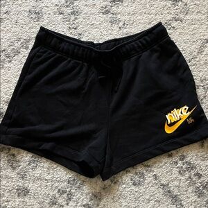 Nike Black Women's Athletic Shorts with Gold Swoosh
